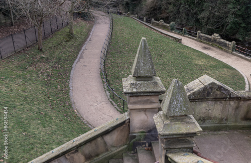 A view of St.Bernards Bridge and Elongated park on the waterfront of The Water of Leith near Stockbridge and Dean Village in the city of Edinburgh. The peaceful scenery, Space for text,Selective focus photo