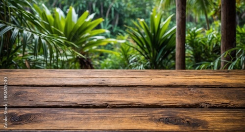 rustic wooden table and, in the background, a tropical landscape blurred with nature, evergreen plants, vegetation, and sky, to use as a background for products.