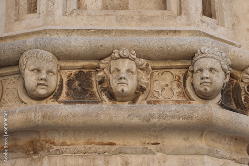 SIBENIK, CROATIA-June 05,2024: view of St James cathedral in Sibenik, UNESCO world heritage site in Croatia. Sibenik, The Cathedral, Croatia. Famous faces on the side protal of Sibenik cathedral. photo