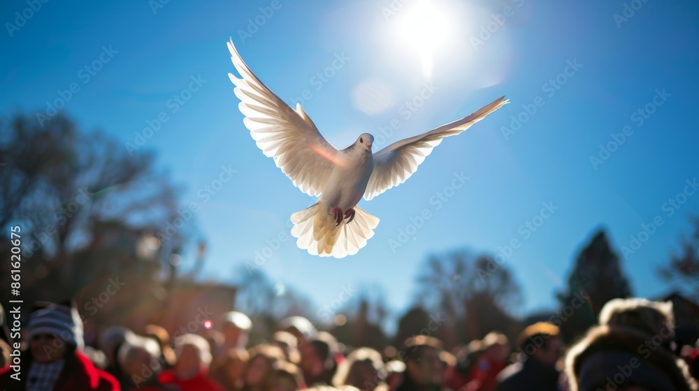 Obraz premium Peace Dove Flying Above Crowd Symbolizing Freedom and Unity for Social Campaigns