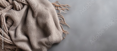 A beige knitted blanket on ...