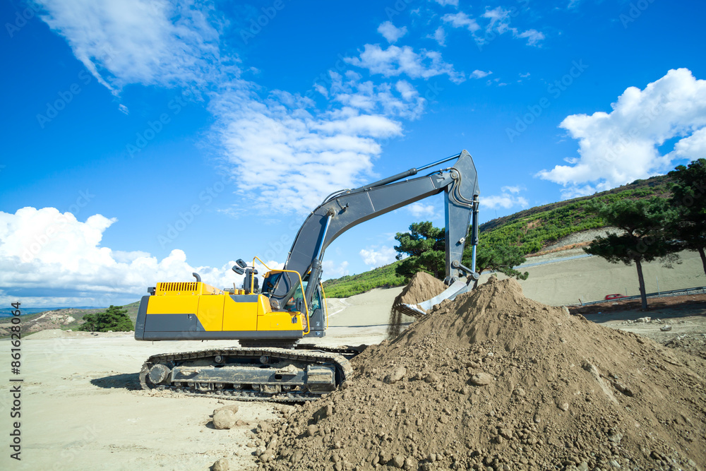 Obraz premium Large excavator is working on construction site 