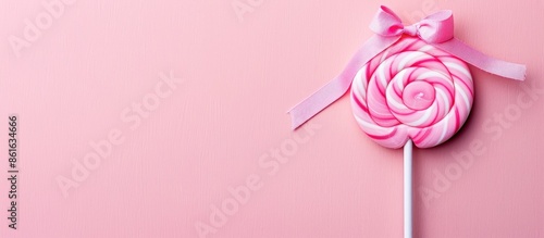 Pink round lollipop with a ...