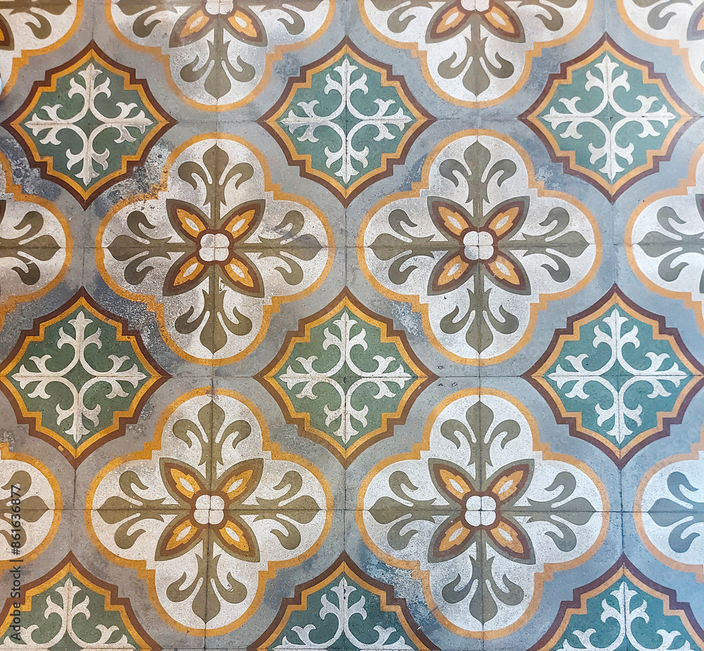 An elegant tile floor decorated with a charming floral pattern An elegant tile floor decorated with a charming floral pattern