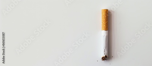 A cigarette with a white ba...