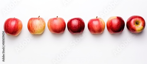 Fresh apples displayed alon...