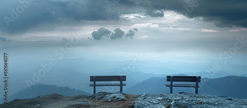 Bench on mountain peak over...