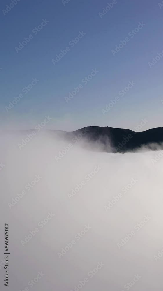 Mountains and Cloud Inversion on Sunny Day. Aerial Drone Reveal Shot. Madeira, Portugal. Moving Forward and Upwards. Vertical Video Mountains and Cloud Inversion on Sunny Day. Aerial Drone Reveal Shot. Madeira, Portugal. Moving Forward and Upwards. Vertical Video