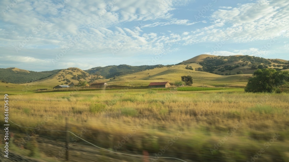 Rolling hills dotted with charming farmhouses passing by the train windows. Rolling hills dotted with charming farmhouses passing by the train windows.