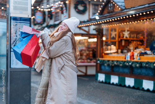 Canvas Print Woman Holding Shopping Bags at a Christmas Market