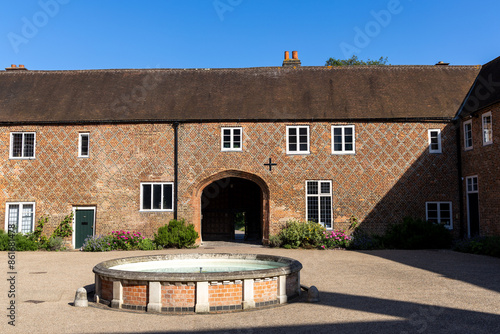 Inner courtyard with fountain and entrance to Fulham palace, London, England