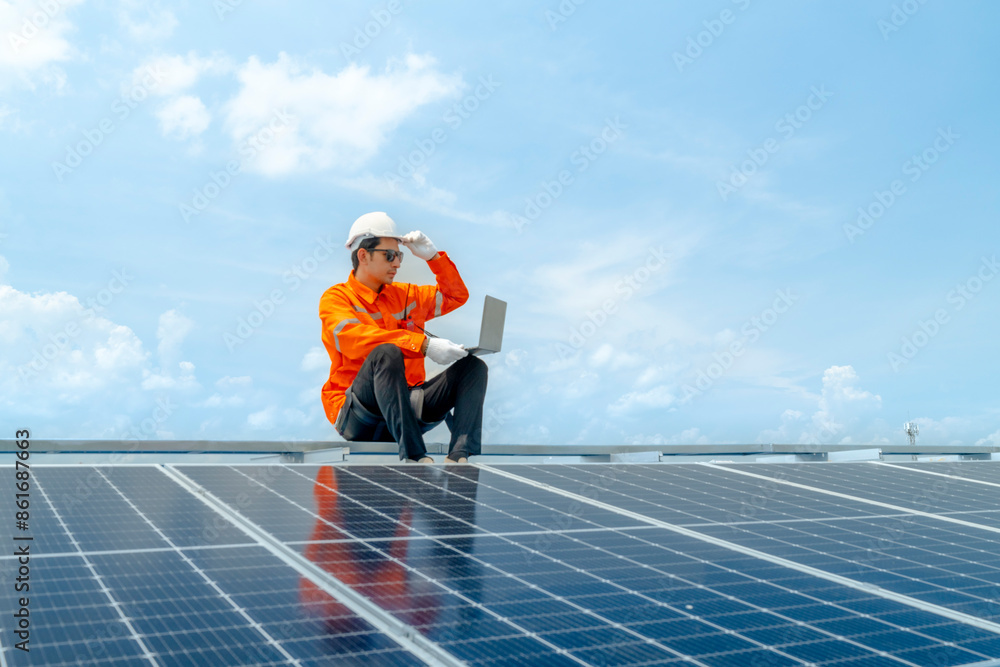 custom made wallpaper toronto digitalengineer man inspects construction of solar cell panel or photovoltaic cell by electronic device. Industrial Renewable energy of green power. factory worker working on tower roof.