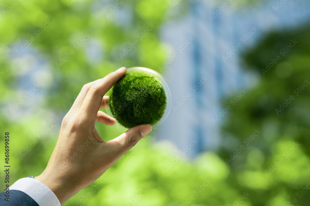 Environmental concept, ecology and business, sustainable environment Net zero greenhouse gas emissions target. Businessman holding a green globe nature background Environmental concept, ecology and business, sustainable environment Net zero greenhouse gas emissions target. Businessman holding a green globe nature background