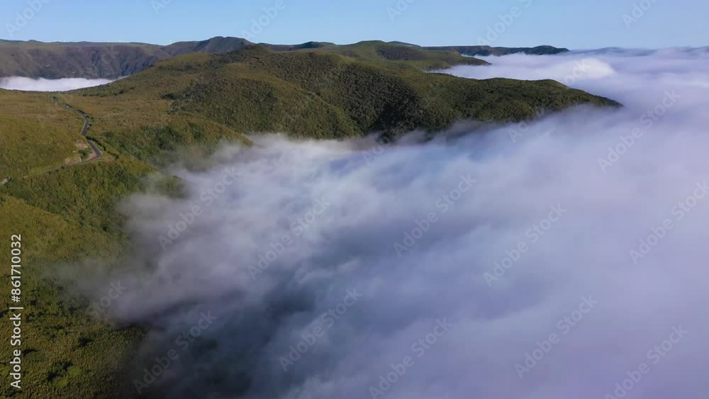 Green Mountains and Clouds Inversion on Sunny Day. Aerial Drone Reveal Shot. Madeira, Portugal. Moving Forward, Tilt Up Green Mountains and Clouds Inversion on Sunny Day. Aerial Drone Reveal Shot. Madeira, Portugal. Moving Forward, Tilt Up