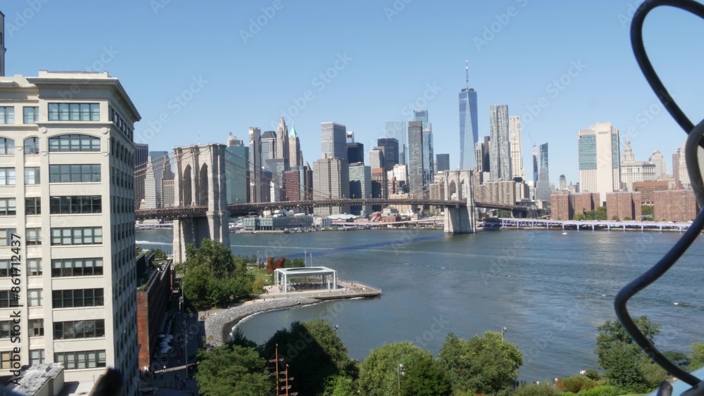 Fototapeta premium Brooklyn Bridge from Manhattan Bridge. New York City downtown skyline, financial district cityscape, World Trade Center. Travel USA. Architecture by East River water, United States. Dumbo carousel