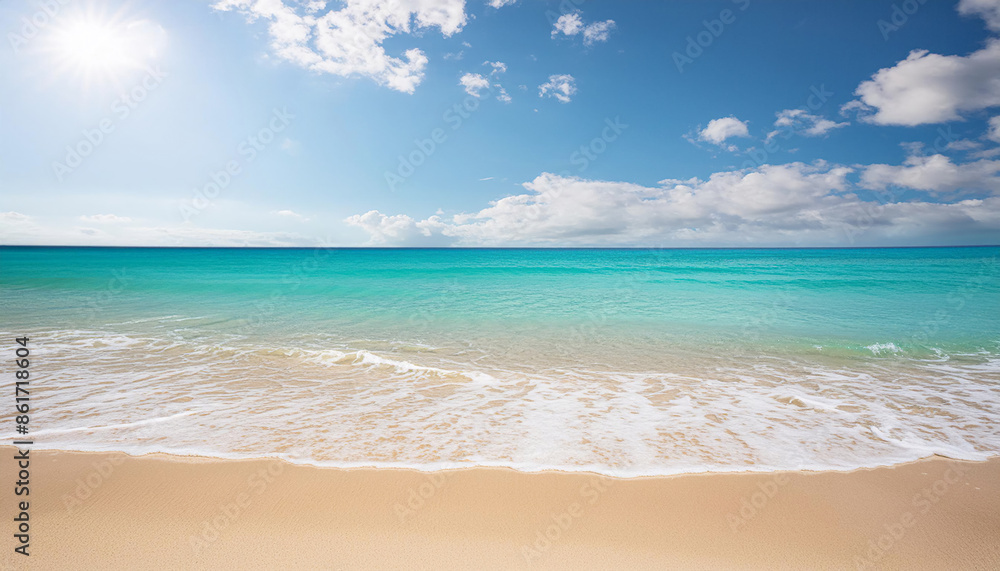 Fototapeta premium Tranquil beach with clear turquoise waters lapping onto white sandy shore under a partly cloudy sky, tropical travel nature relaxation tourism