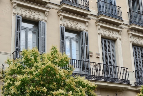 Elegant windows and balconies on the classical building facade downtown Madrid, Spain © Yana Demenko