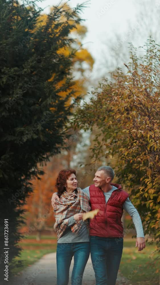 Hello autumn. happy modern family in the park walking. Hello autumn. happy modern family in the park walking.