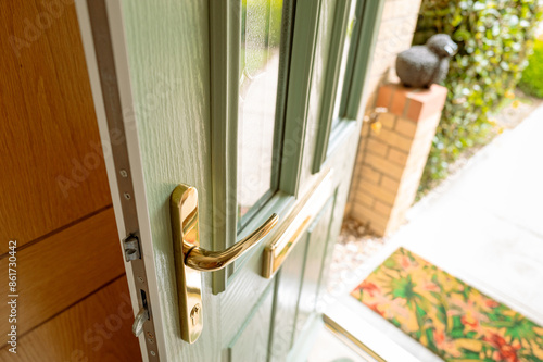 Obraz na płótnie Newly installed, uPVC front door showing the brass fittings