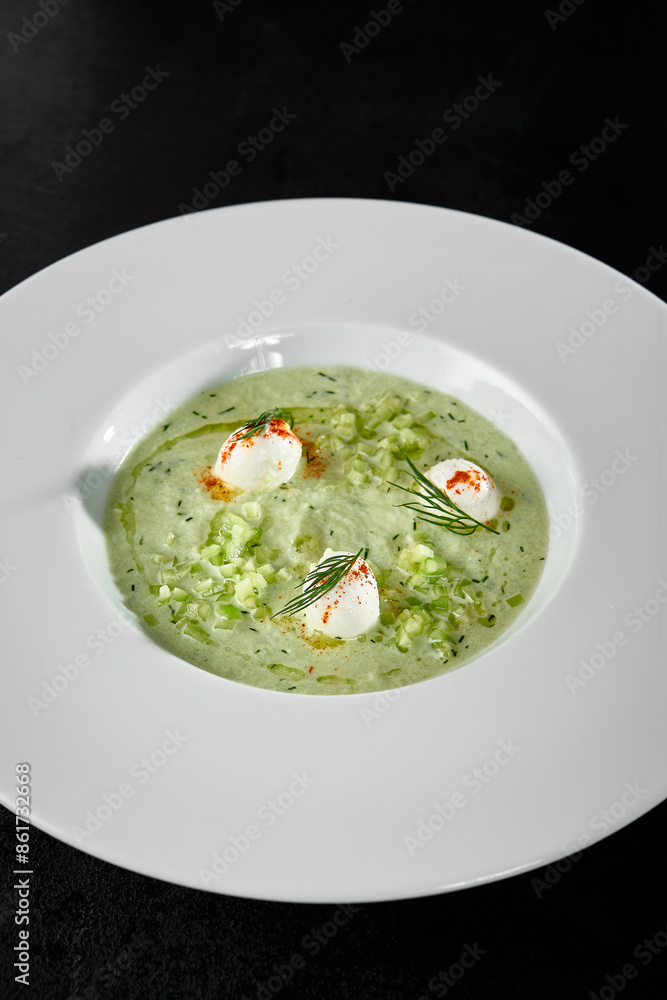 Refreshing Cucumber Gazpacho Soup with Mozzarella Balls in White Bowl