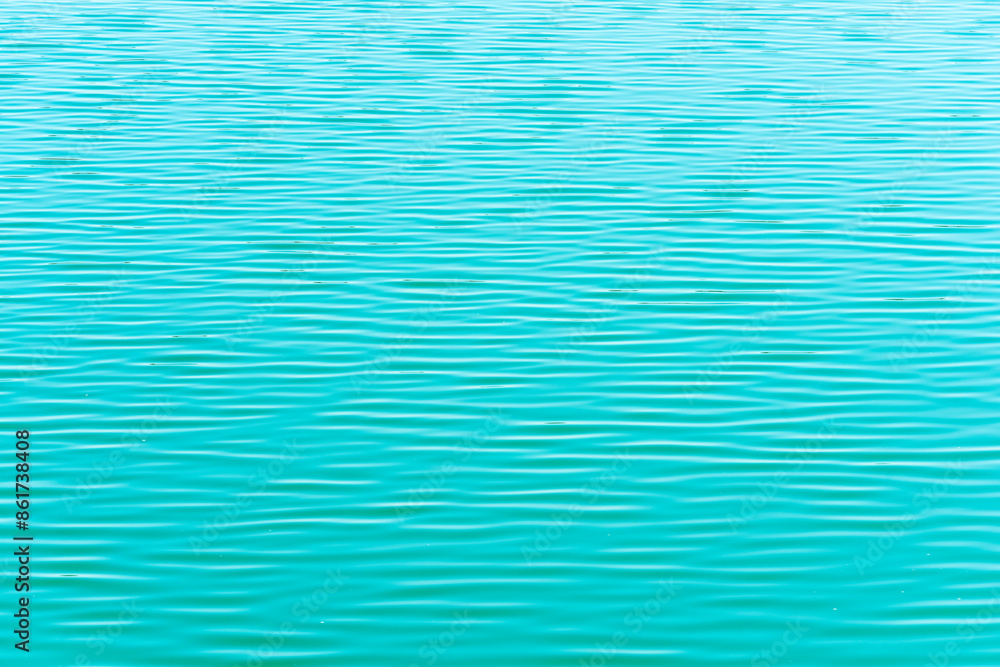 Ondas de agua en la superficie de un lago de diferentes tonalidades de color, textura Ondas de agua en la superficie de un lago de diferentes tonalidades de color, textura
