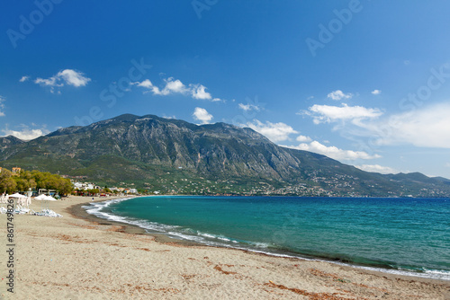 Obraz na płótnie The sandy shore of Kalamata town in southern Greece (Peloponnese region) with the majestic Mount Taygetus in the background. w salonie