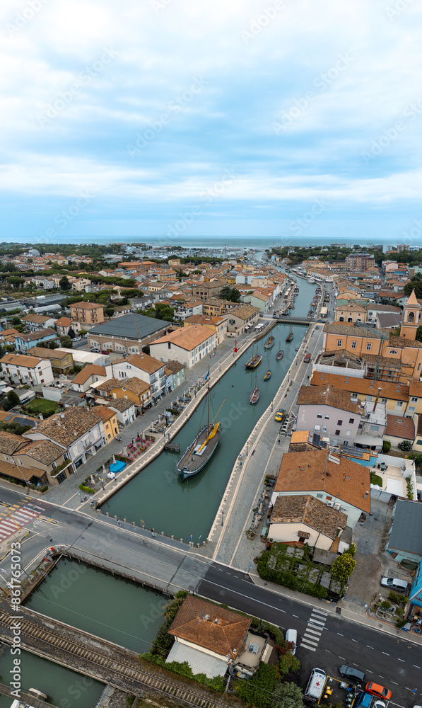 ITALY, 24 June 2024: aerial and panoramic view in 4k of Cesenatico with its beach, its sea and its canal with historic boats. We are on the Romagna coast in the province of Rimini ITALY, 24 June 2024: aerial and panoramic view in 4k of Cesenatico with its beach, its sea and its canal with historic boats. We are on the Romagna coast in the province of Rimini