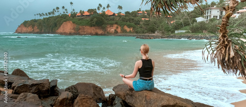 Travel. Travelers woman on the coast of the ocean on a tropical island. Solitude, wildlife, mental health, conscious travel, travel and active life concept. Travel banner photo