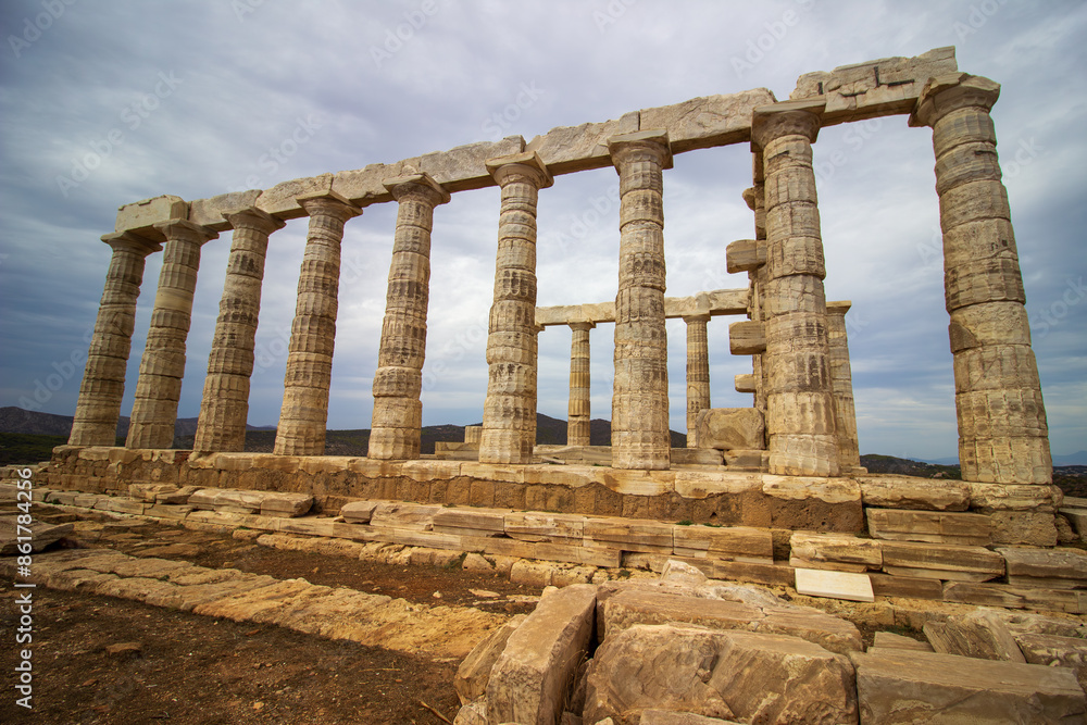The ancient ruin of Poseidon, Cape of Sounion with cloudy weather near Athens, Greece. The ancient ruin of Poseidon, Cape of Sounion with cloudy weather near Athens, Greece.