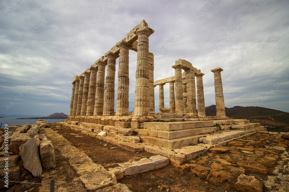 Fototapeta premium The ancient ruin of Poseidon, Cape of Sounion with cloudy weather near Athens, Greece.