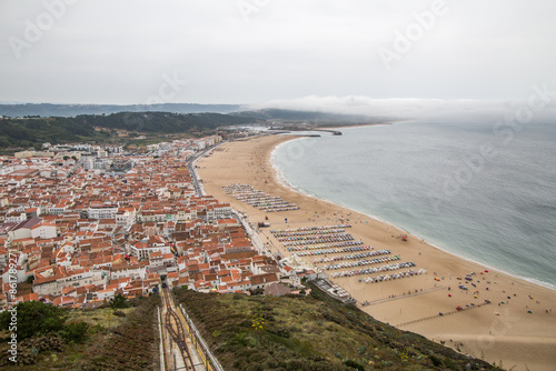 Beautiful beach with cliffs and a littile river. Beach of Paredes Vitoria - Nazare - Portugal photo