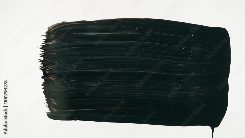 Fototapeta premium Black paint streak drawn on glass surface. Drawing with black acrylic paint on white isolated background. Monochrome art painting, minimalism