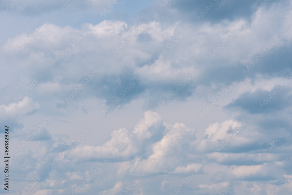 Fototapeta premium Dense gray thunderstorm cumulus wavy clouds in the whole frame. Gloomy rainy Sky background to overlay on your photos