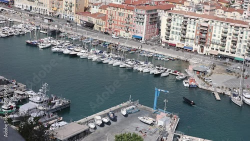 Wallpaper Mural A small black boat is docking amidst numerous white yachts in Nice harbor, South France. Torontodigital.ca