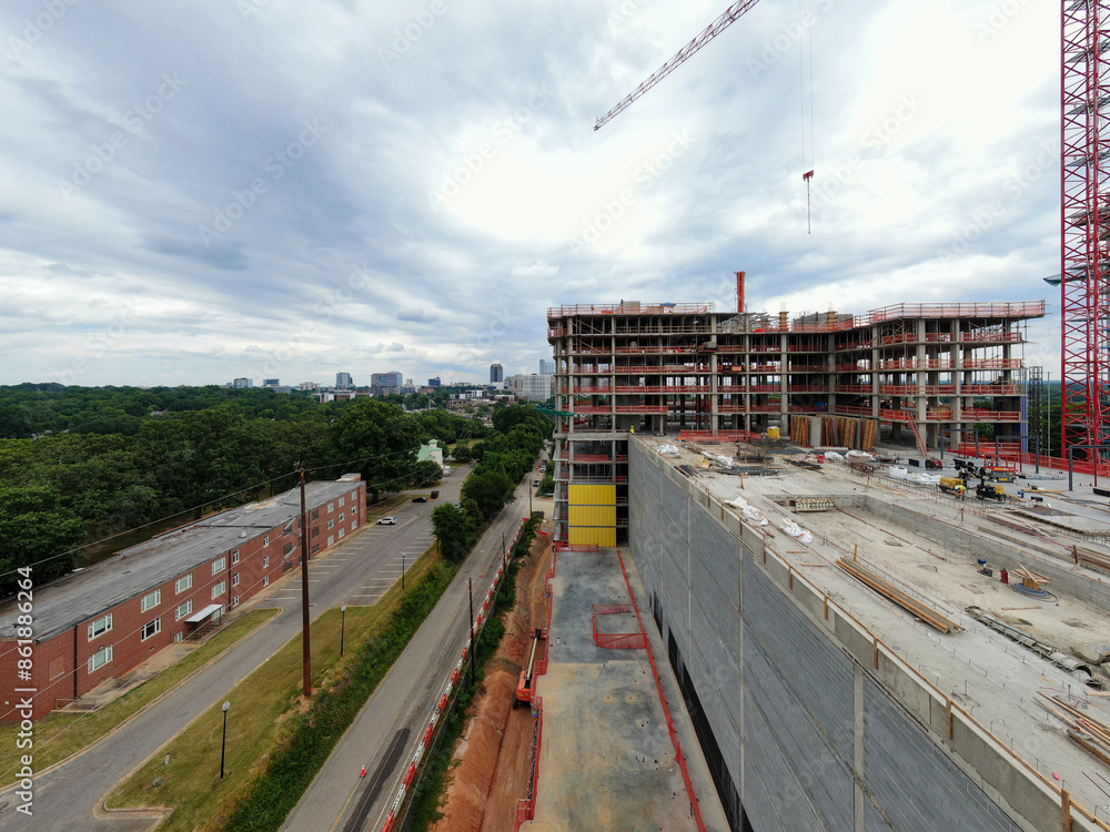 Daytime Drone Images of Highrise Construction and the Skyline in Downtown Raleigh North Carolina. Industry, Architecture, Engineering Daytime Drone Images of Highrise Construction and the Skyline in Downtown Raleigh North Carolina. Industry, Architecture, Engineering