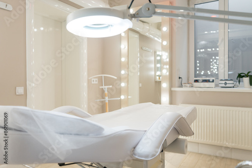 cosmetology room with modern interior, comfortable couch and lamp