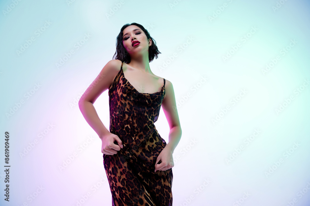 Photo of seductive teasing lady wear dress dancing empty space isolated blue color background Photo of seductive teasing lady wear dress dancing empty space isolated blue color background