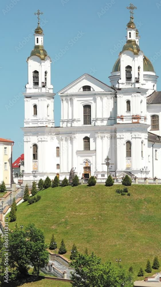 Vitebsk, Belarus. Assumption Cathedral Church In Upper Town On Uspensky Mount Hill In Sunny Summer Day. Zoom, Zoom Out Vitebsk, Belarus. Assumption Cathedral Church In Upper Town On Uspensky Mount Hill In Sunny Summer Day. Zoom, Zoom Out