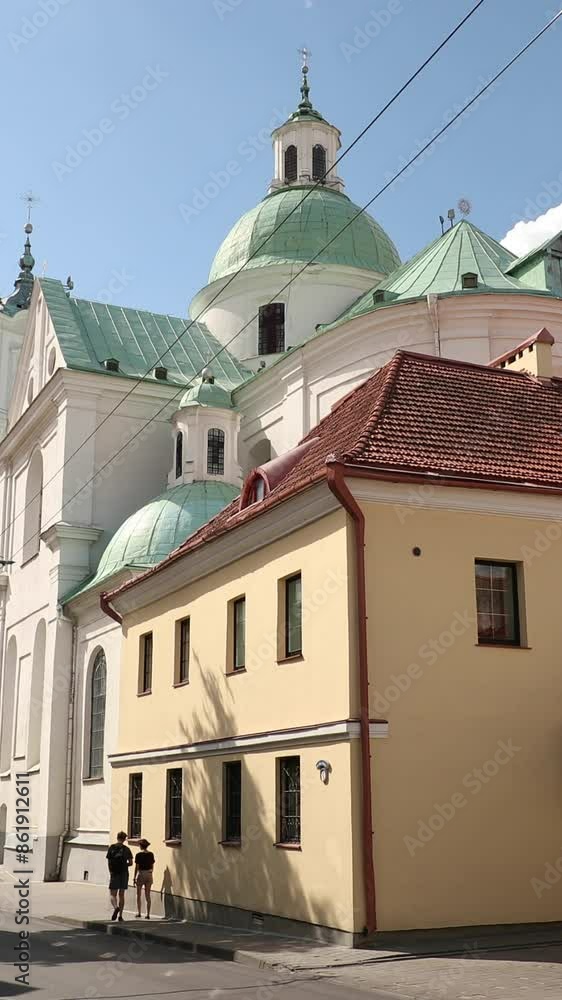 Grodno, Belarus. Famous Landmark Is St. Francis Xavier Cathedral At Summer Day. View From Karla Marksa Street Grodno, Belarus. Famous Landmark Is St. Francis Xavier Cathedral At Summer Day. View From Karla Marksa Street