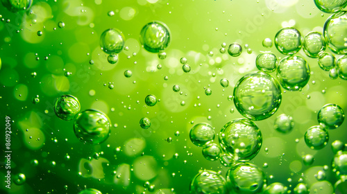 Banner of liquid, drops and bubbles in green color to decorate poster and booklet cover. Abstract background.