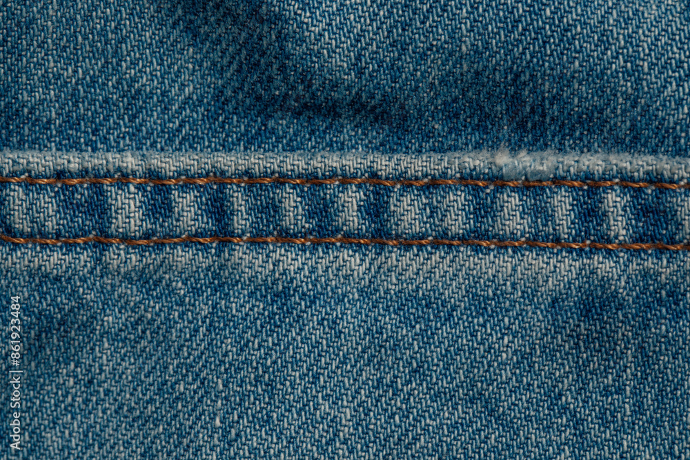 close up of hem, cuff on blue cotton denim jeans close up of hem, cuff on blue cotton denim jeans