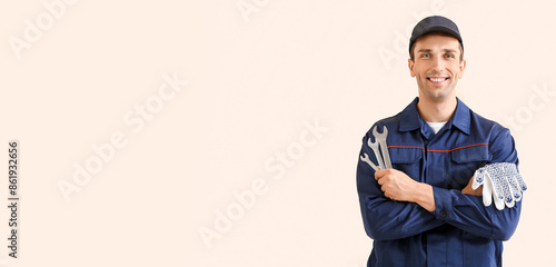 Male car mechanic on color ...
