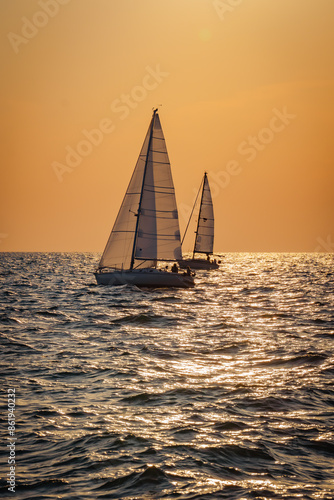 sailboat at sunset at the sea