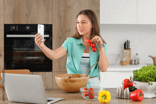 Young woman with tomatoes t...