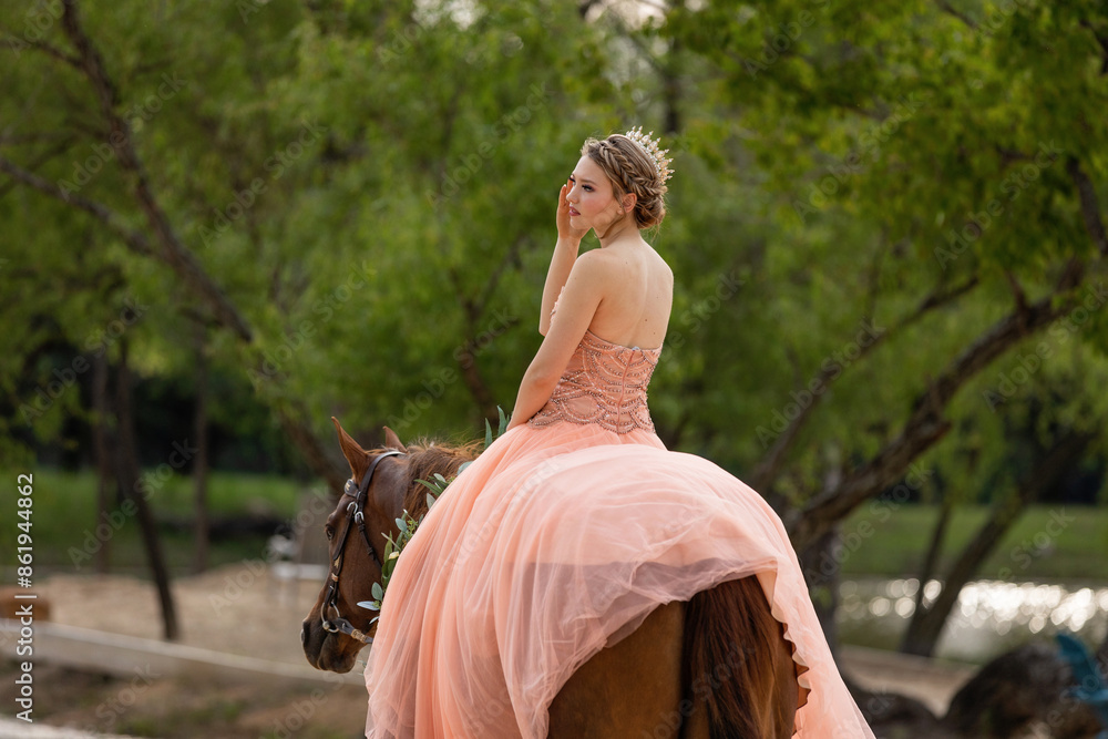 Fototapeta premium Girl in prom dress riding a horse