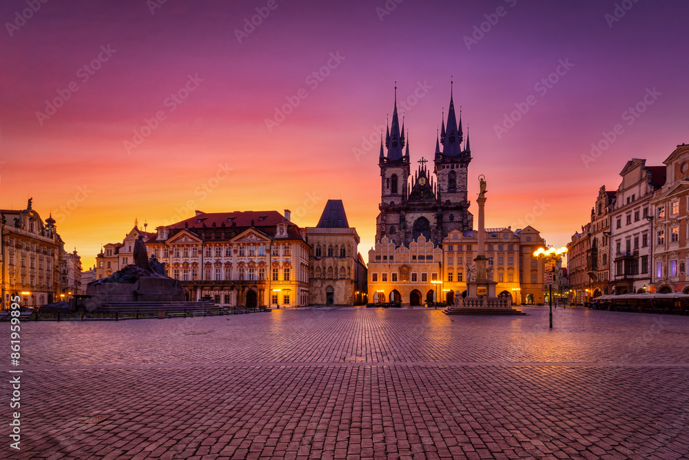 Fototapeta premium The old town square of Prague, Czech Republic, with the famous Tyn Church during a colorful summer sunrise, without people