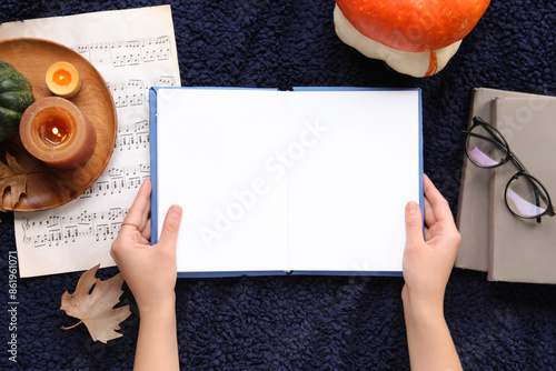 Female hands with blank ope...