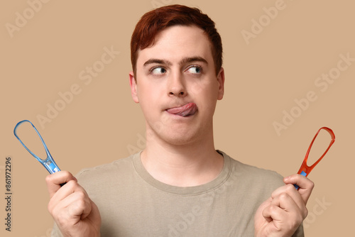 Young man with tongue scrap...