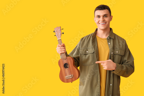 Handsome young man with uku...