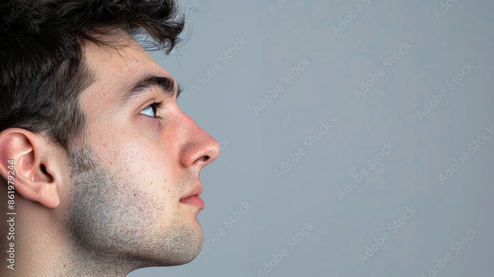 Fototapeta premium Side shot of man with concentrated face.